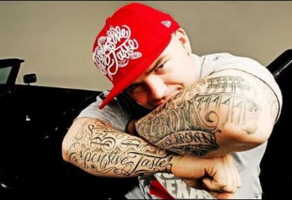 Rapper Paul Wall shows off his tattoos while posing for photos at News  Photo  Getty Images